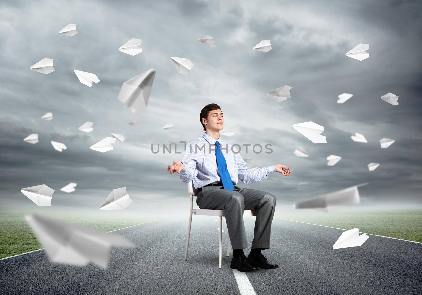 businessman sitting on an office chair, meditation and calmness