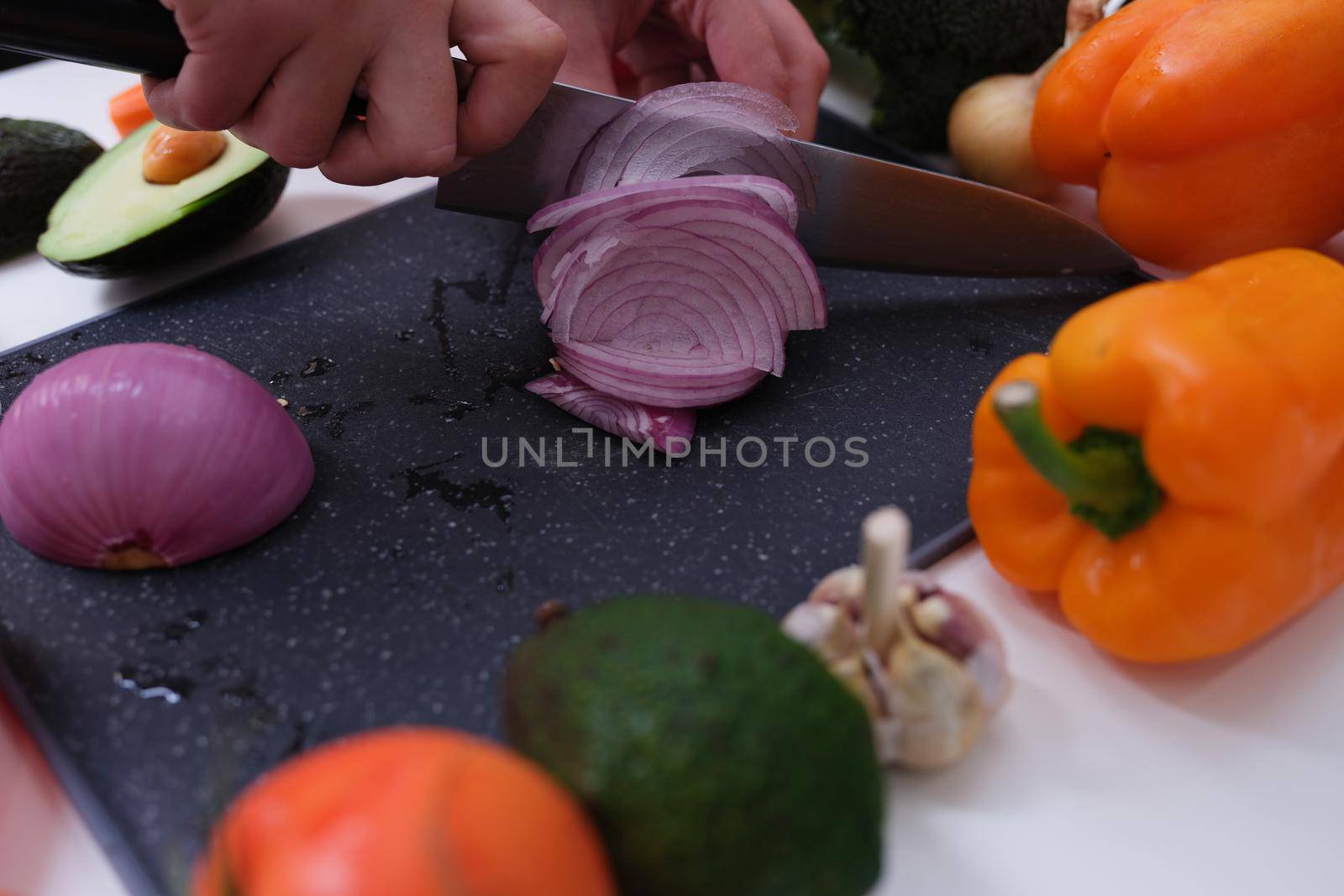 Cutting vegetables red onion and healthy food by kuprevich