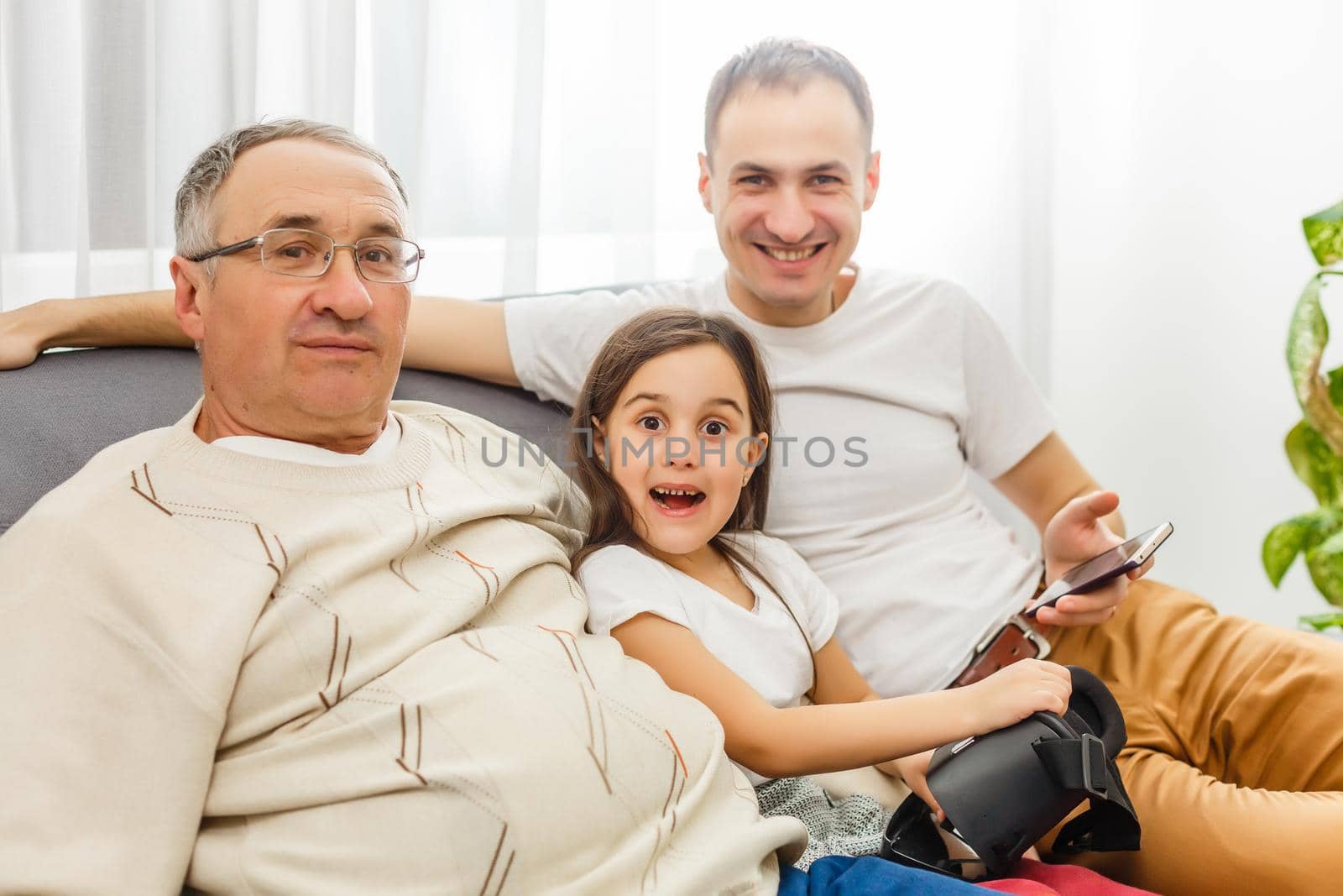 father, son and granddaughter at home