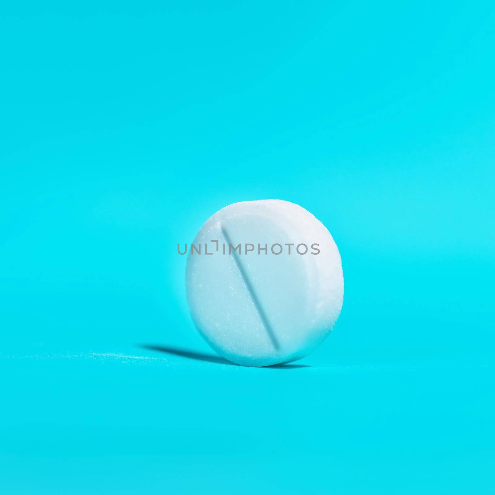 large white tablet on a blue background . by SmartPhotoLab