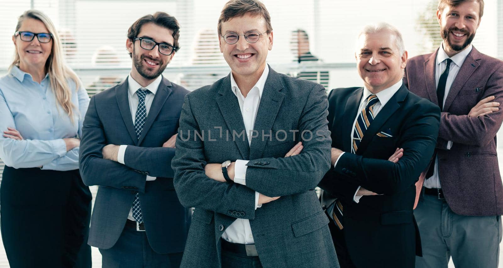 group of experienced employees standing in the office. concept of successful work