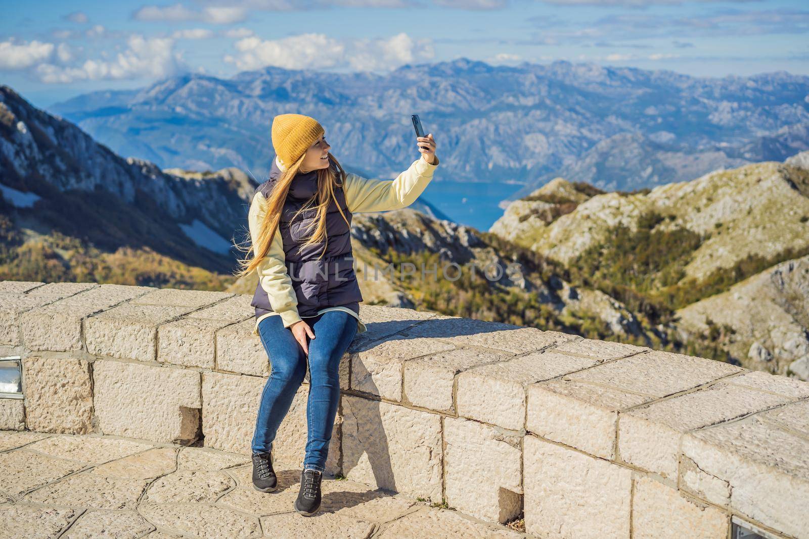 Woman traveller in mountain landscape at national park Lovcen, Montenegro. Travel to Montenegro concept.