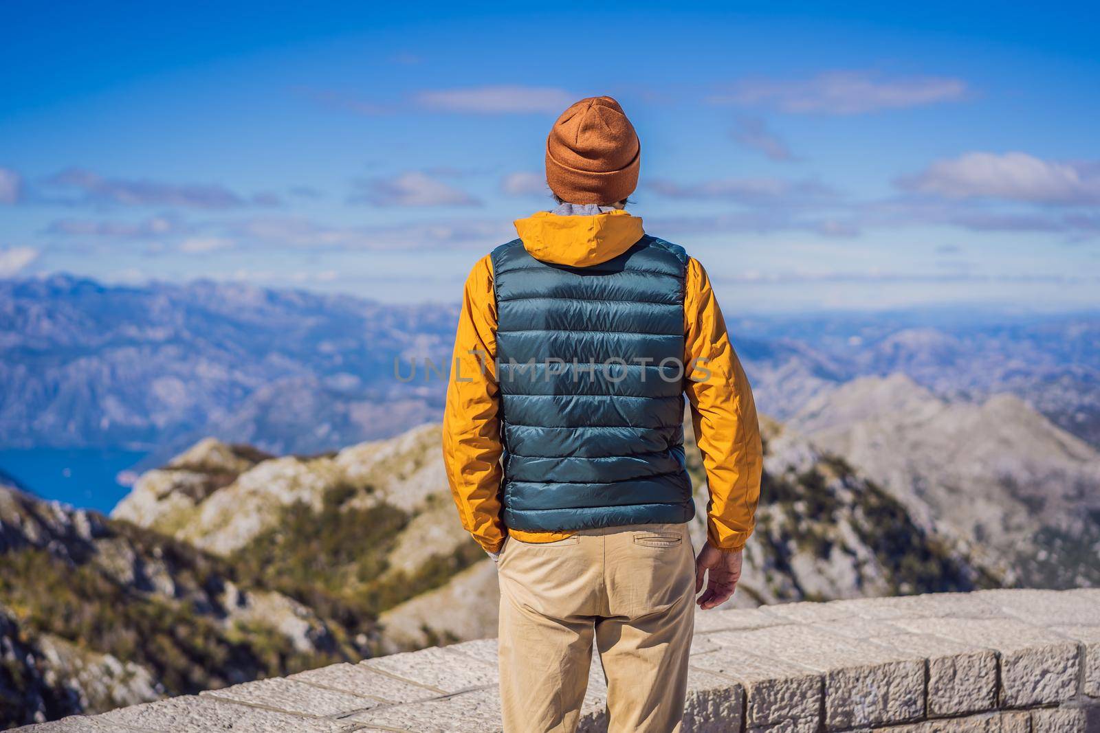 Man traveller in mountain landscape at national park Lovcen, Montenegro. Travel to Montenegro concept.