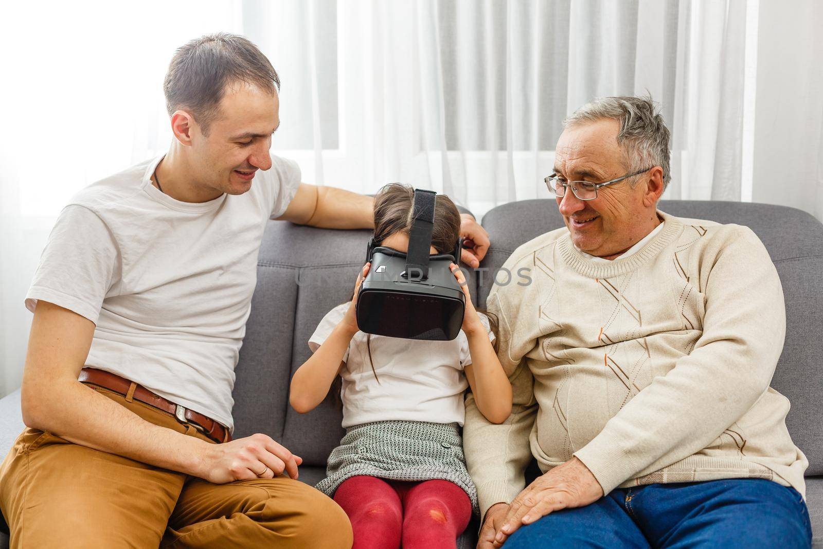 grandfather and granddaughter with virtual glasses.