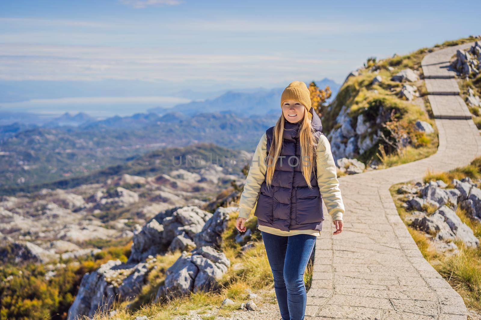 Woman traveller in mountain landscape at national park Lovcen, Montenegro. Travel to Montenegro concept by galitskaya