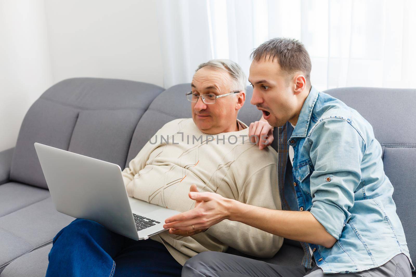 Two men in living room talking