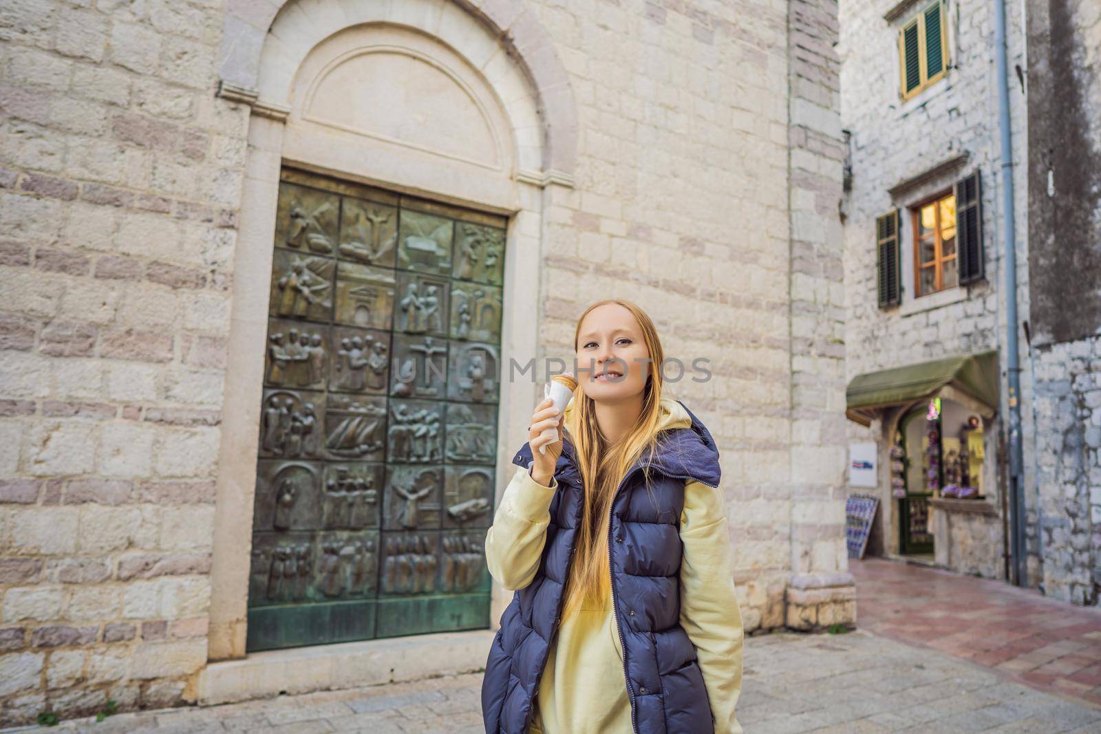 Woman tourist enjoying Colorful street in Old town of Kotor on a sunny day, Montenegro. Travel to Montenegro concept by galitskaya