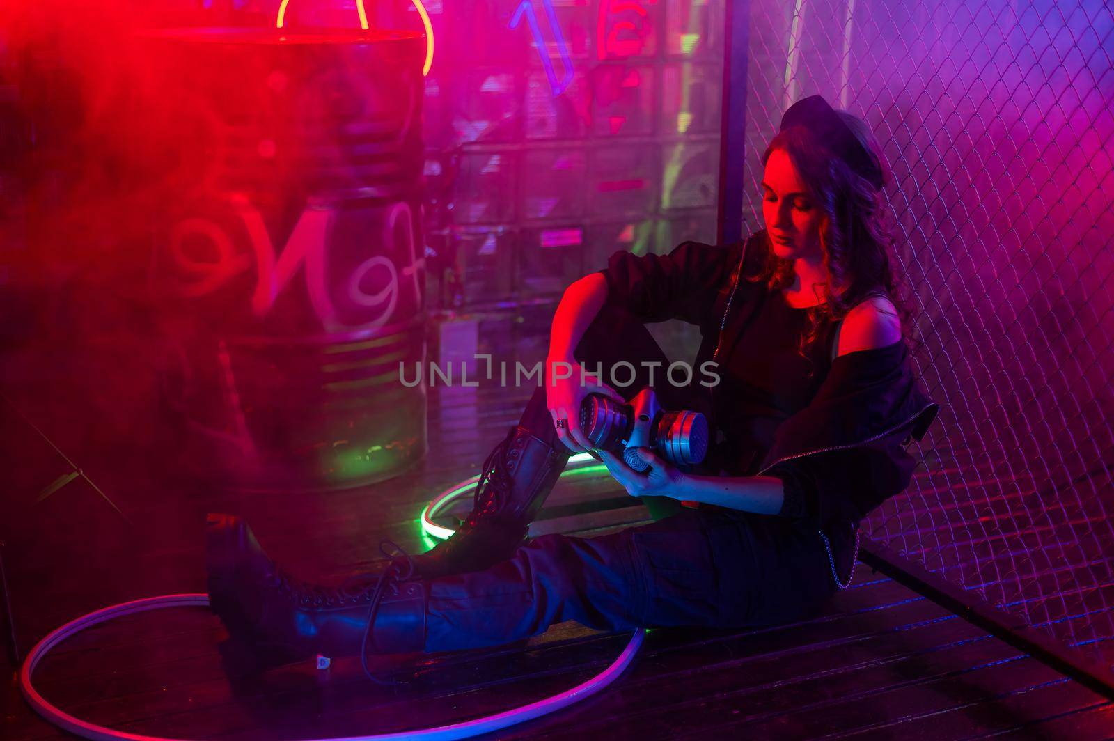 Caucasian woman posing in fog in neon studio. by mrwed54