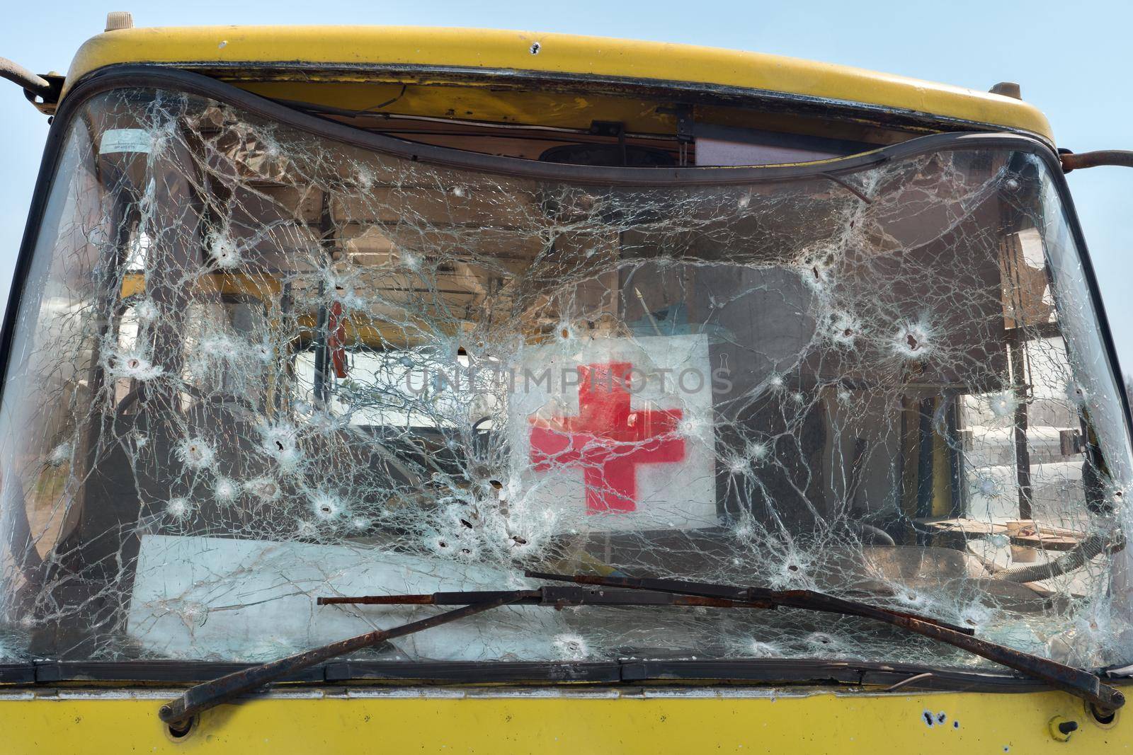 Bus evacuating civilian shooting bullet glass hole shot bullet windshield broken icon red cross sign humanitarian logo. 2022 War Russia invasion Ukraine war crimes. Mark bullet car destroyed bus crash