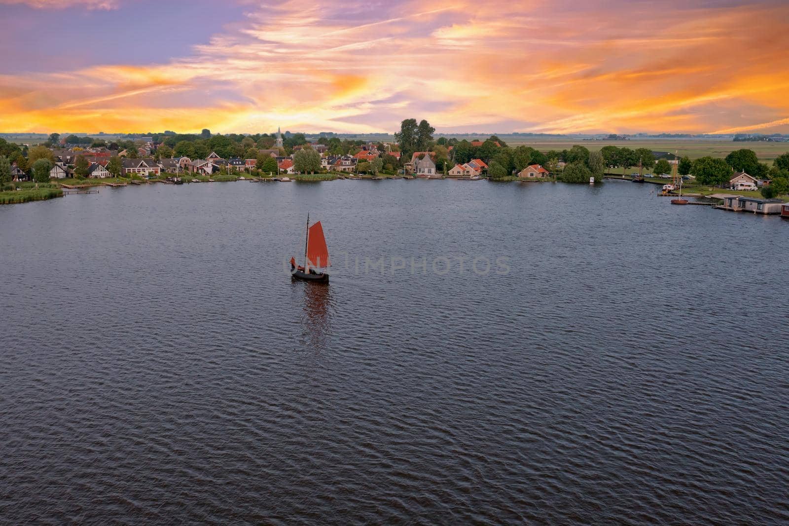 Aerial from the village Oudega in the Netherlands at sunset