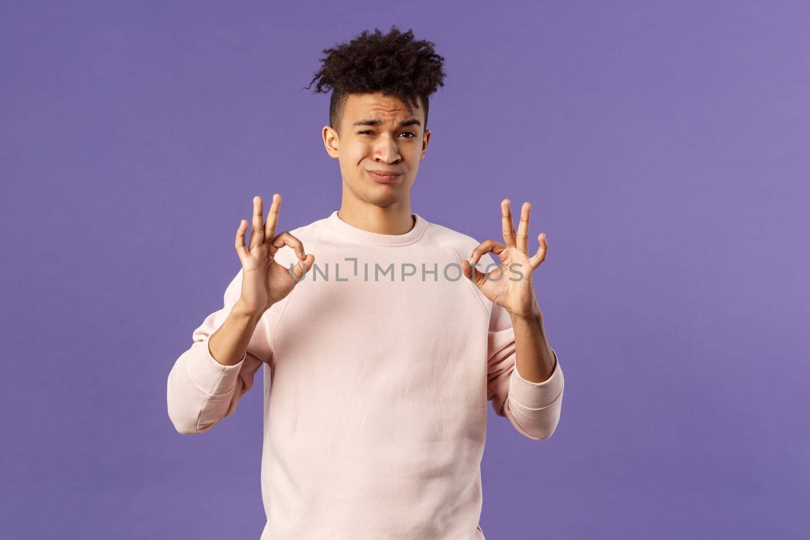 Portrait of skeptical young hispanic man rate something normal quality, show okay sign and grimacing judgemental, saying its not bad but average, standing purple background by Benzoix