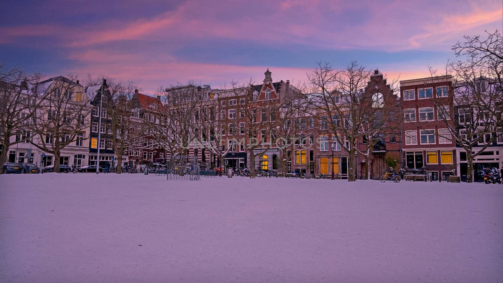 City scenic from a snowy Amsterdm in winter in the Netherlands