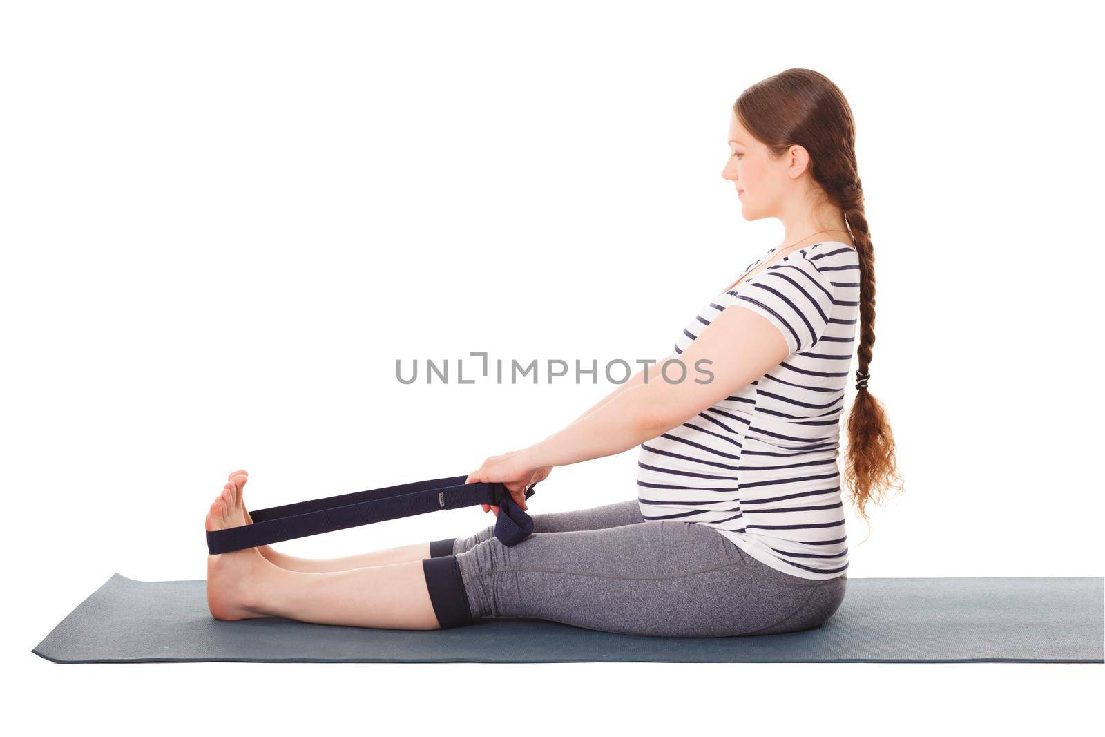Pregnant woman doing yoga asana Dandasana by dimol
