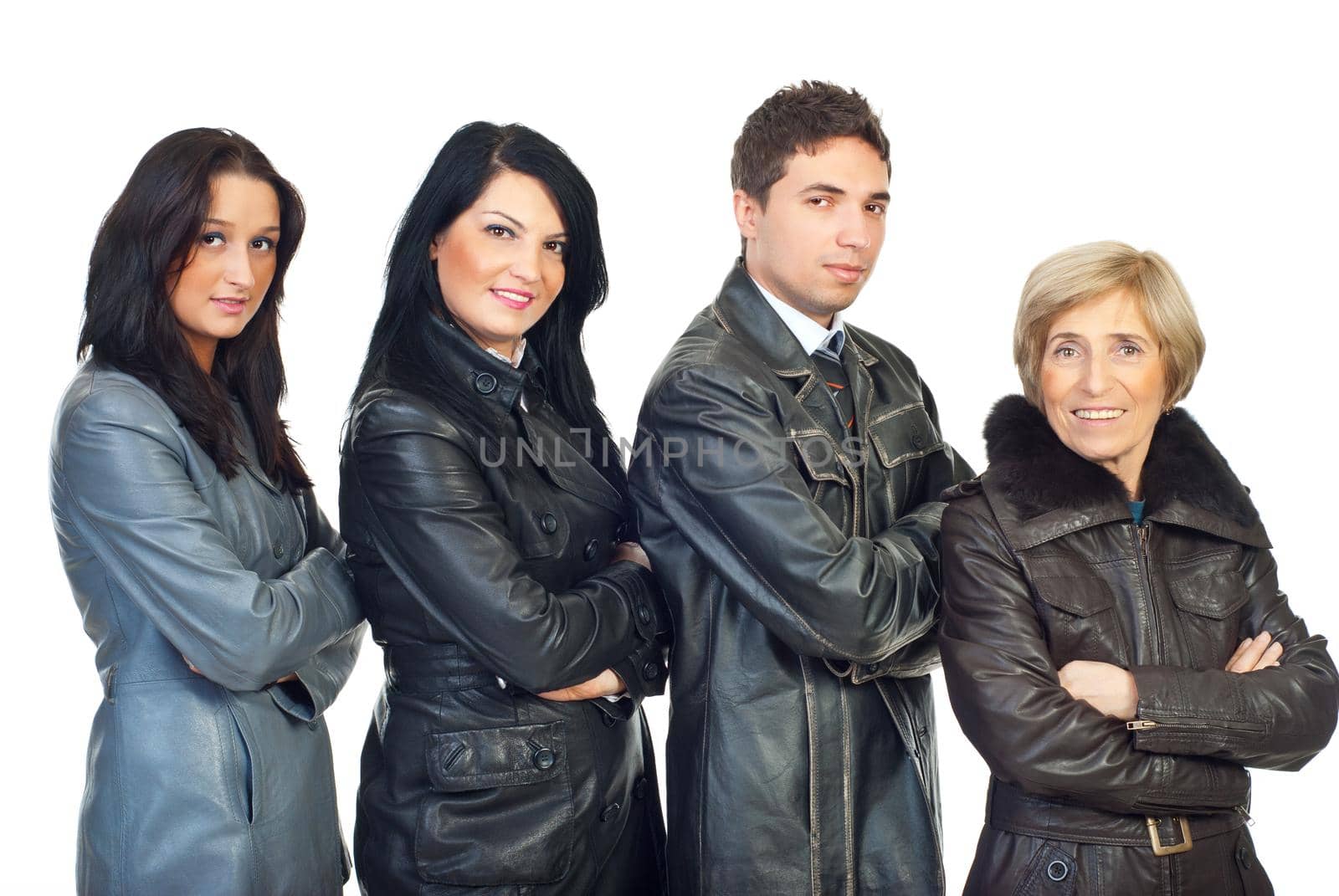 Four people  wearing differrent  leather jackets colors and models and standing  in a line in semi profile  with hands crossed  isolated on white background