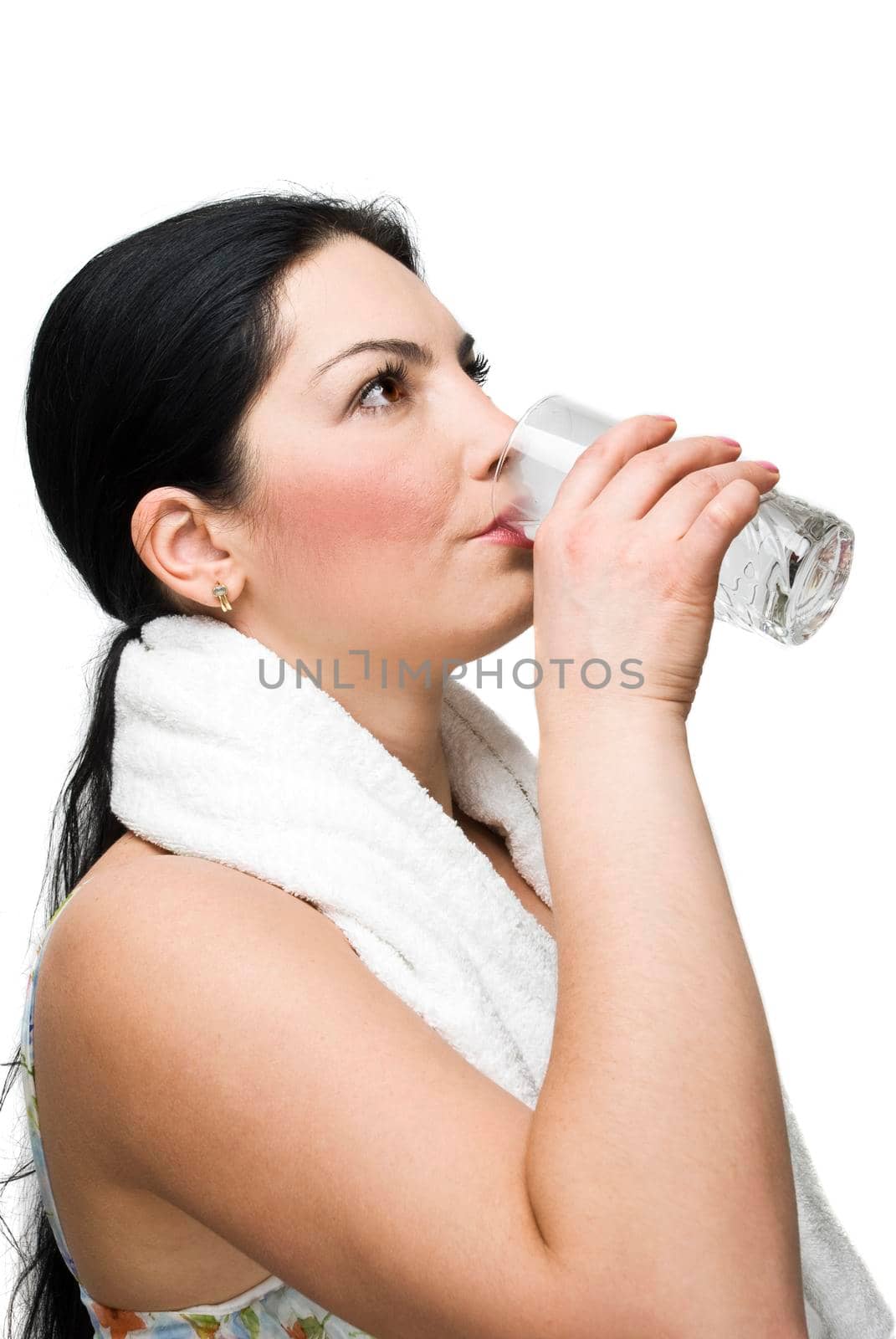 Woman drinking a glass of water by justmeyo