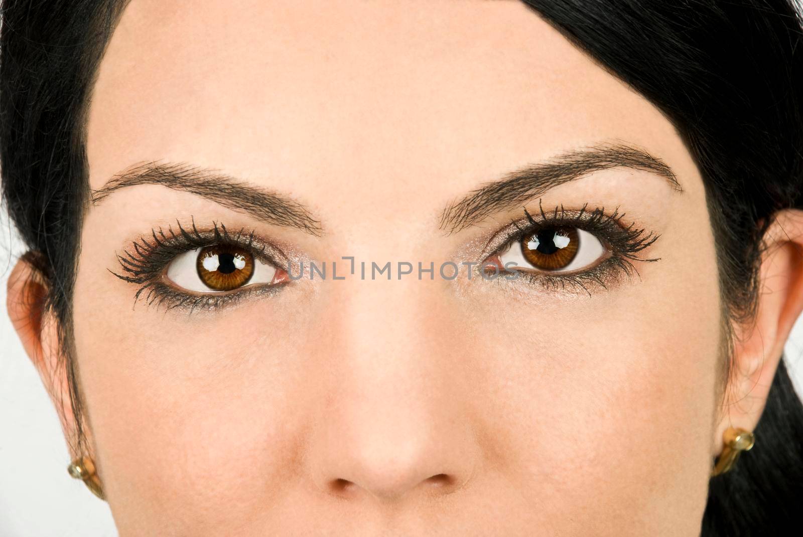 Part of beautiful woman face with brown eyes