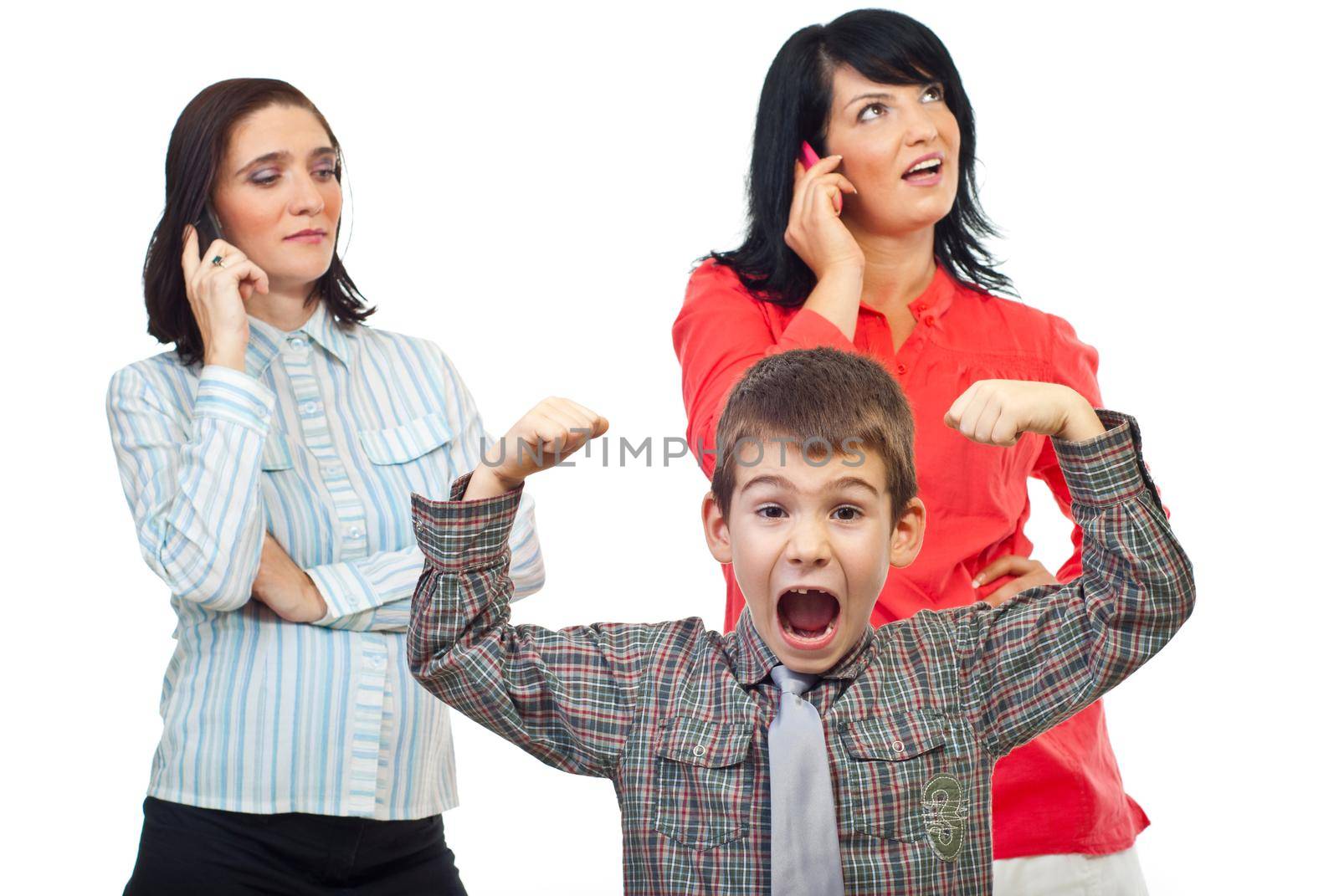 Exasperated child about two women who talk on the phone mobile and do not pay attention to him isolated on white background