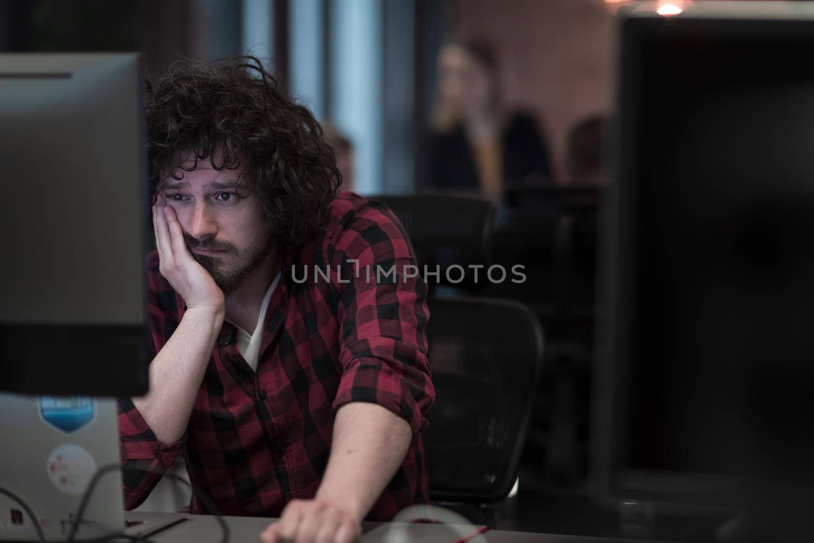 Disappointed businessman wearing headset having virtual team meeting group call chatting with diverse people in customer support. Video conference call on a computer with manager and employees. High-quality photo