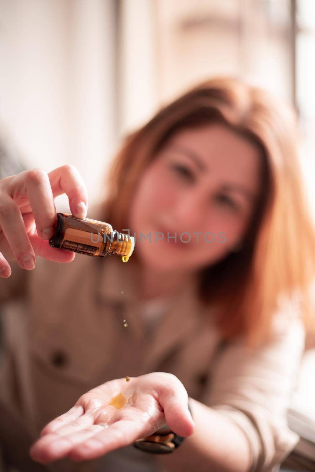 Woman try dropping with essence of oils, humidifier doTERRA by FranciscoStockLife