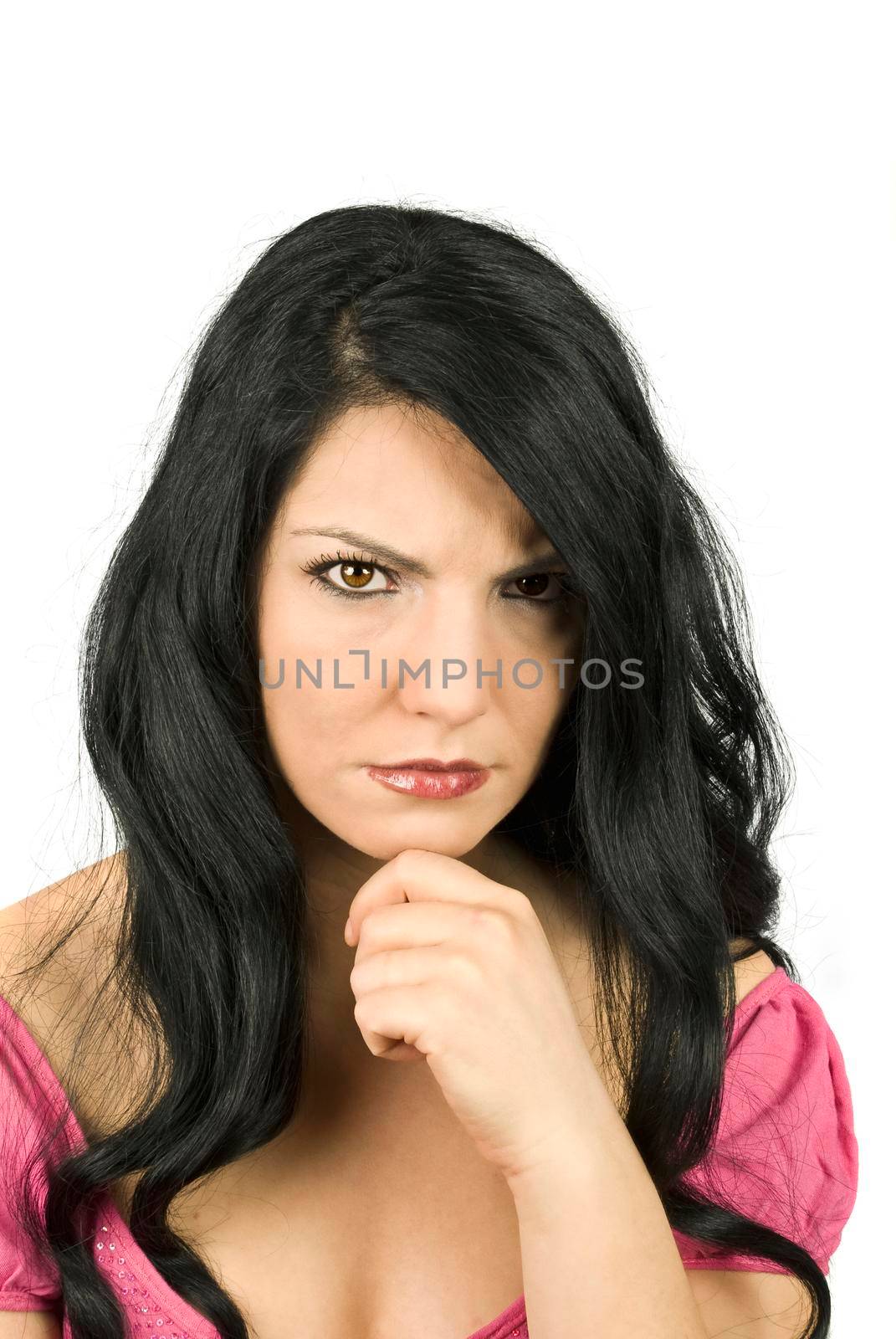 Beautiful brunette angry woman standing sulky with hand at chin isolated on white background