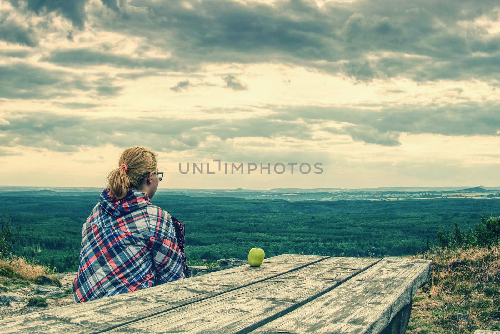 Blonde girl sits alone at edge  above the abyss  by rdonar2