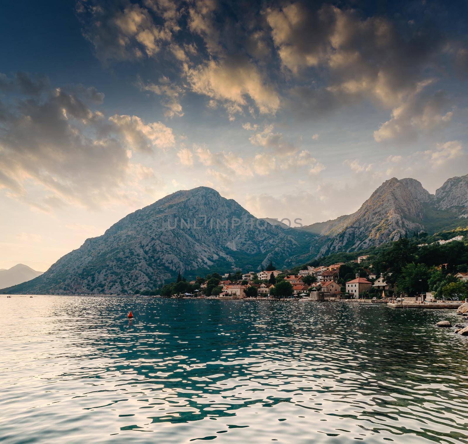 Sunset, beautiful landscape with silhouettes of trees. Travel concept. Montenegro, Kotor Bay. Sunset at Kotor Bay Montenegro. View of the sunset in Boko-Kotor Bay in Montenegro. Silhouettes of mountains. High quality photo