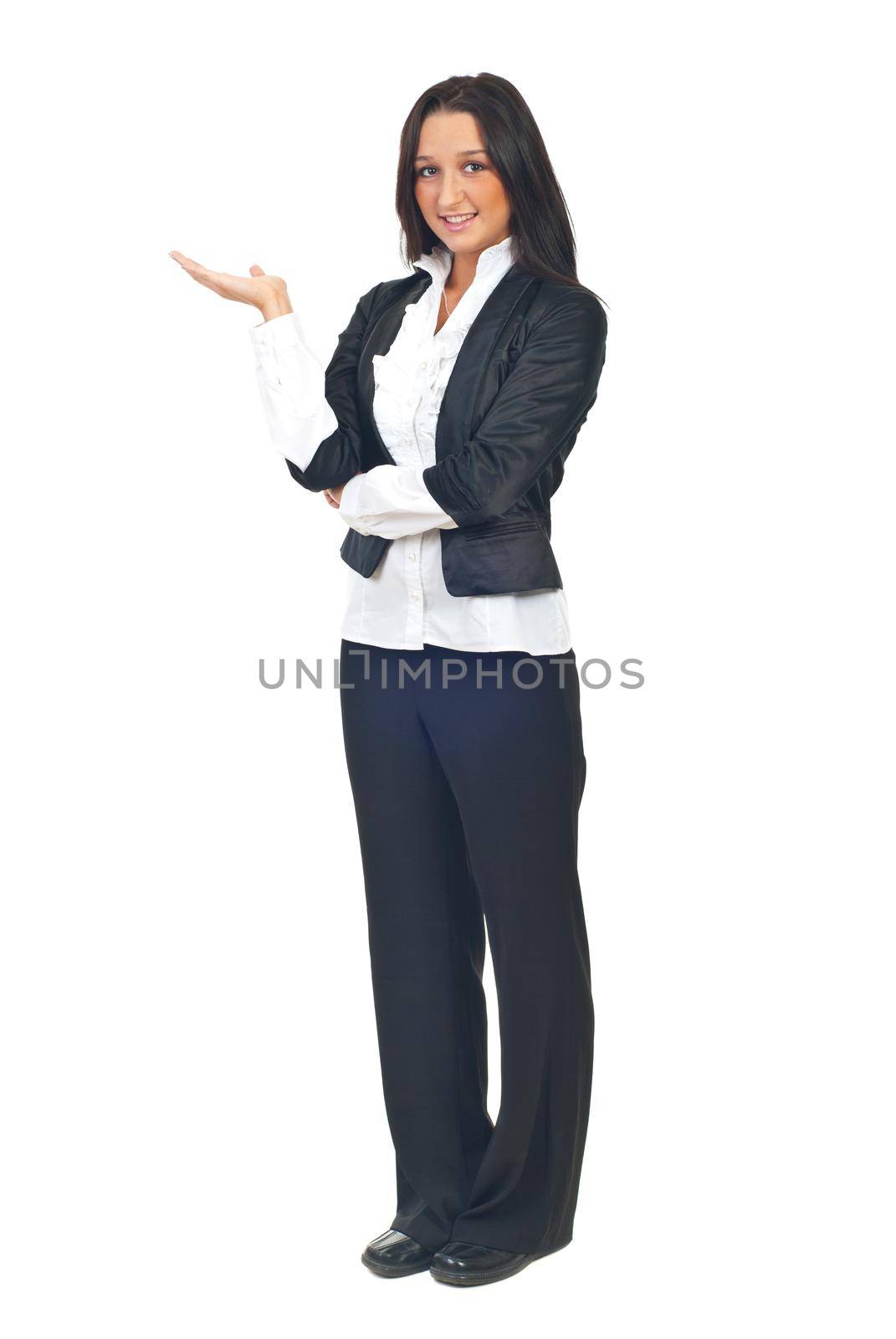 Full length of young businesswoman making presentation to copy space and standing with palm open isolated on white background