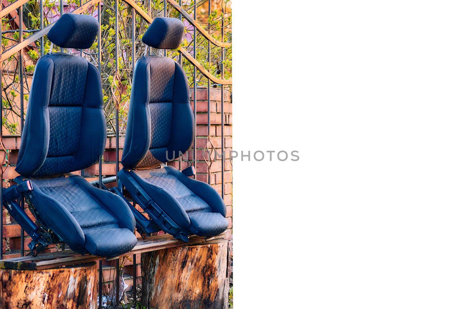 Two car seats drying in the sun after dry cleaning and place for text by jovani68