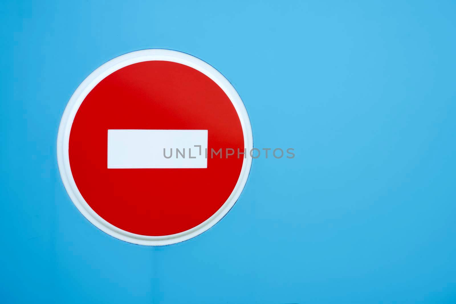 Stop road sign on blue isolated background by jovani68