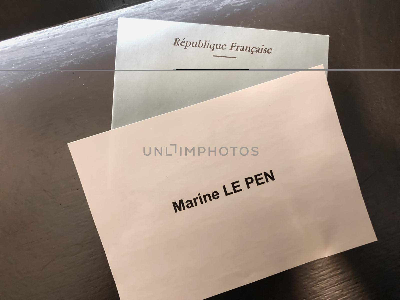 PARIS, FRANCE - APRIL 10, 2022: Ballots with the names of candidates for elections in France. Translation Republic of France.Marine Le pen.