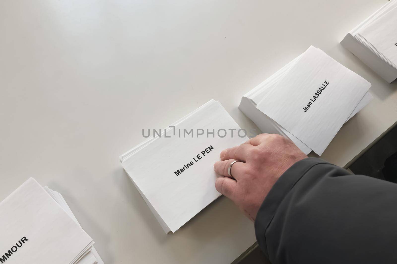 PARIS, FRANCE - APRIL 10, 2022 :Ballots with the names of candidates for elections in France