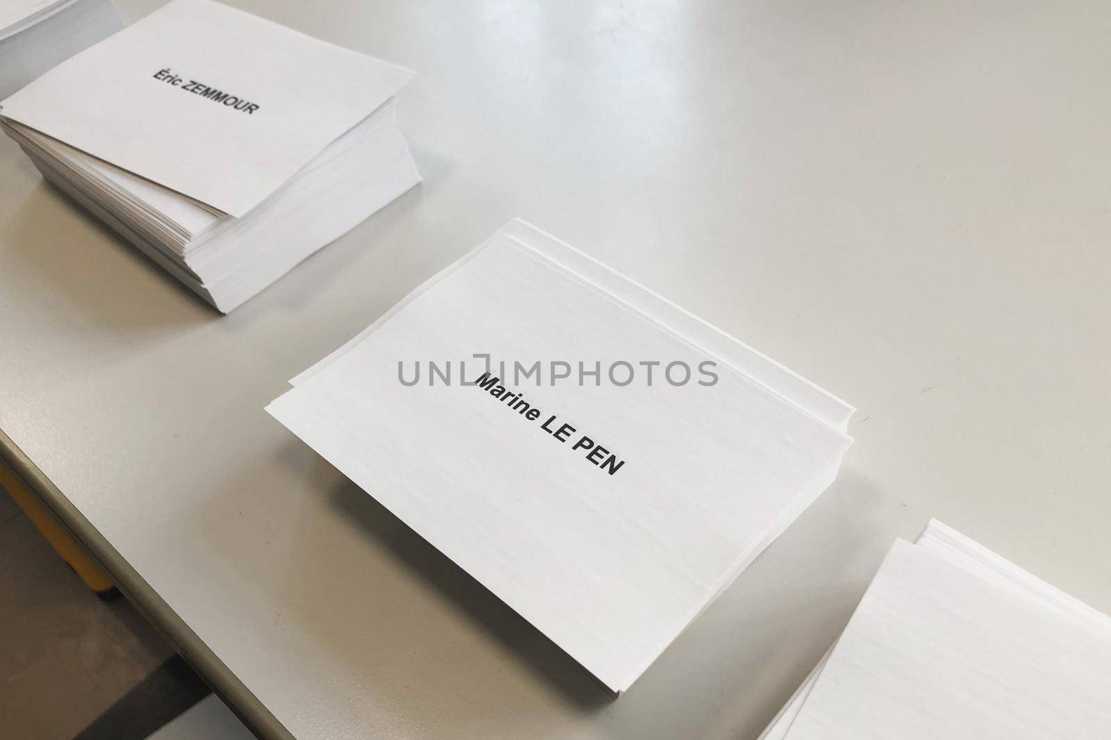 PARIS, FRANCE - APRIL 10, 2022 :Ballots with the names of candidates for elections in France