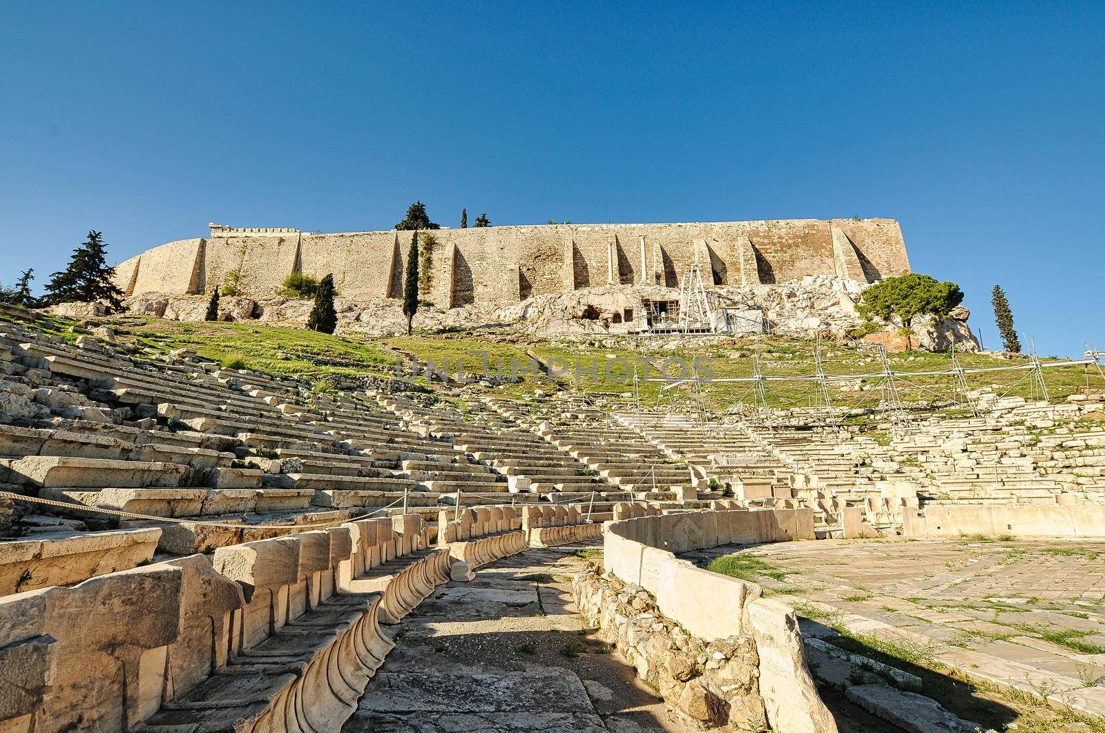 Ancient theater in a summer day in Acropolis Greece, Athnes by feelmytravel