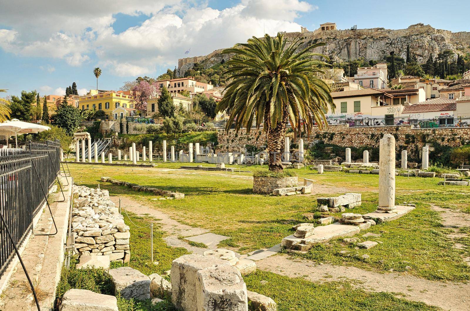 Ruins of Roman Agora in the neighbourhood of Plaka with the Acropolis hill in the background, Athens, Greece