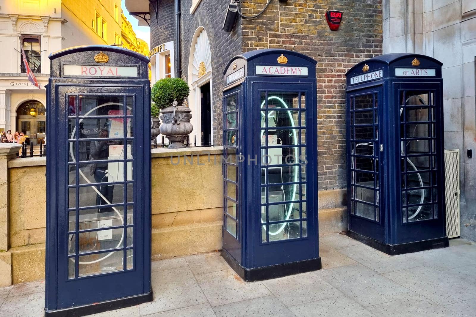 London, United Kingdom, February 8, 2022: blue telephone boxes on a London street