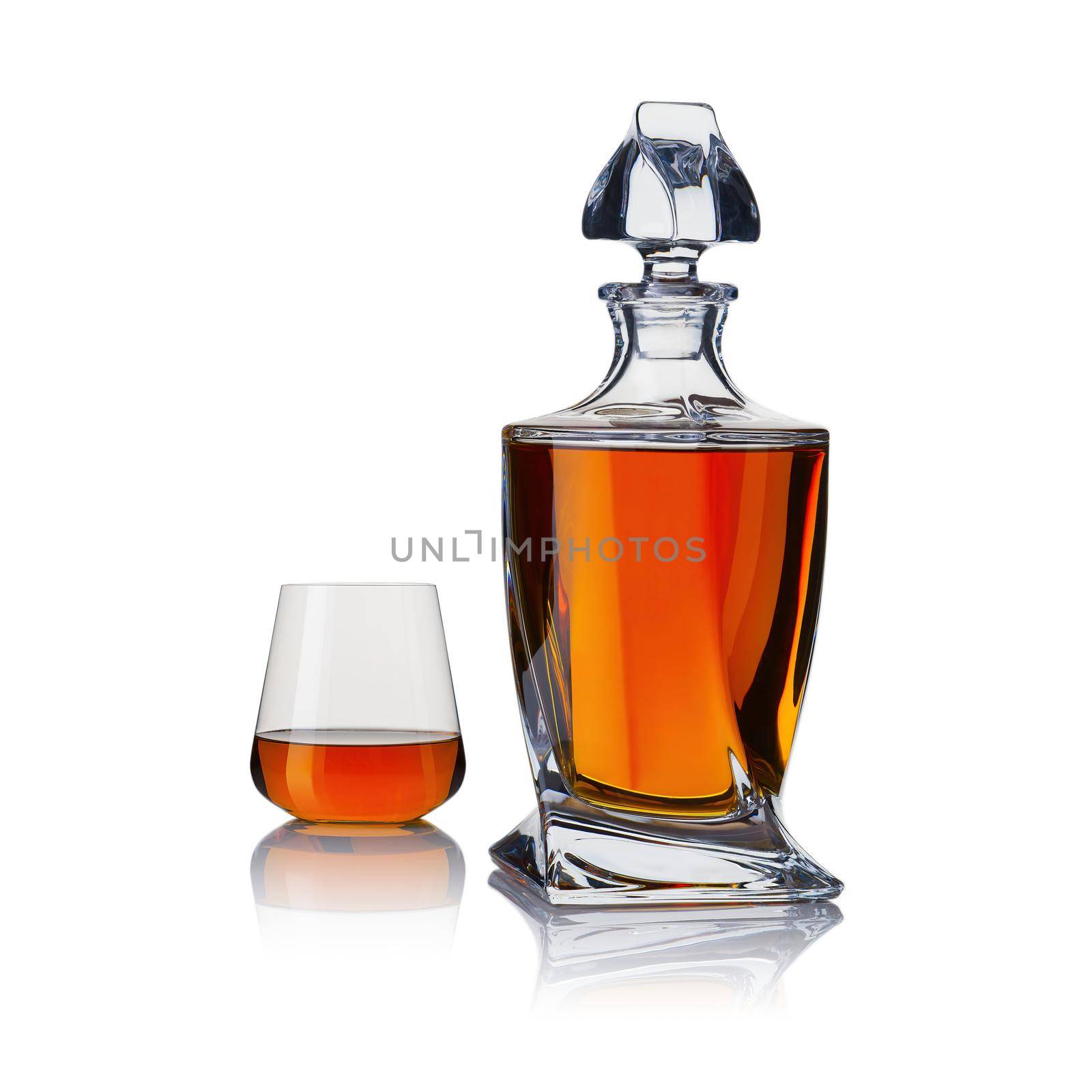 Decanter with whiskey and whiskey glasses. Carafe and glass of whiskey on a white background.