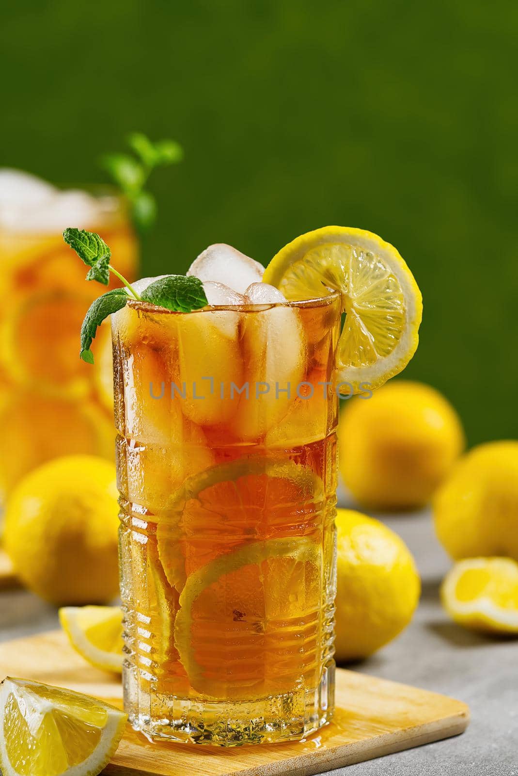 Iced tea. Traditional iced tea with lemon and ice in tall glasses by PhotoTime
