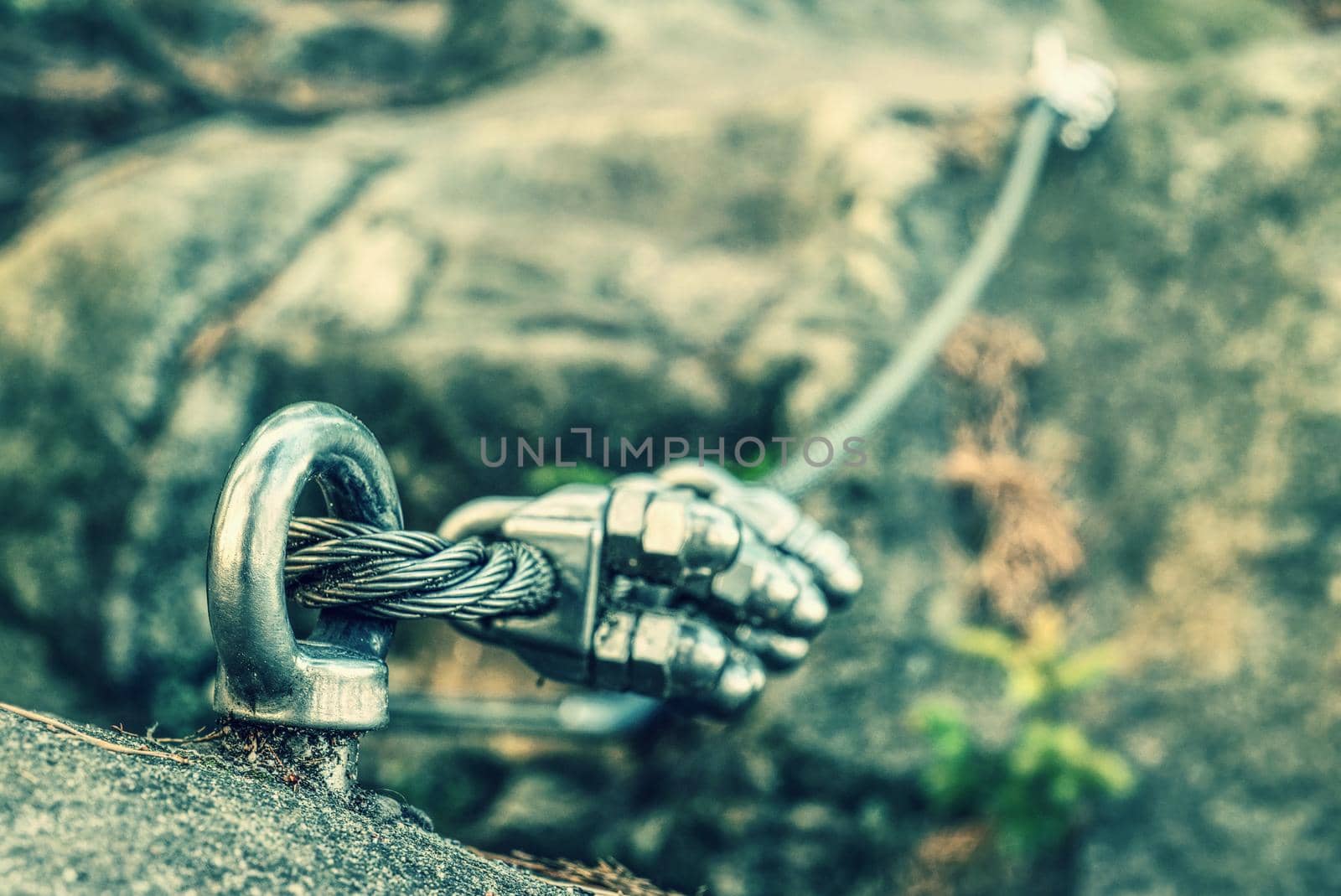 Climbing anchor or carabiner attached to rock by rdonar2