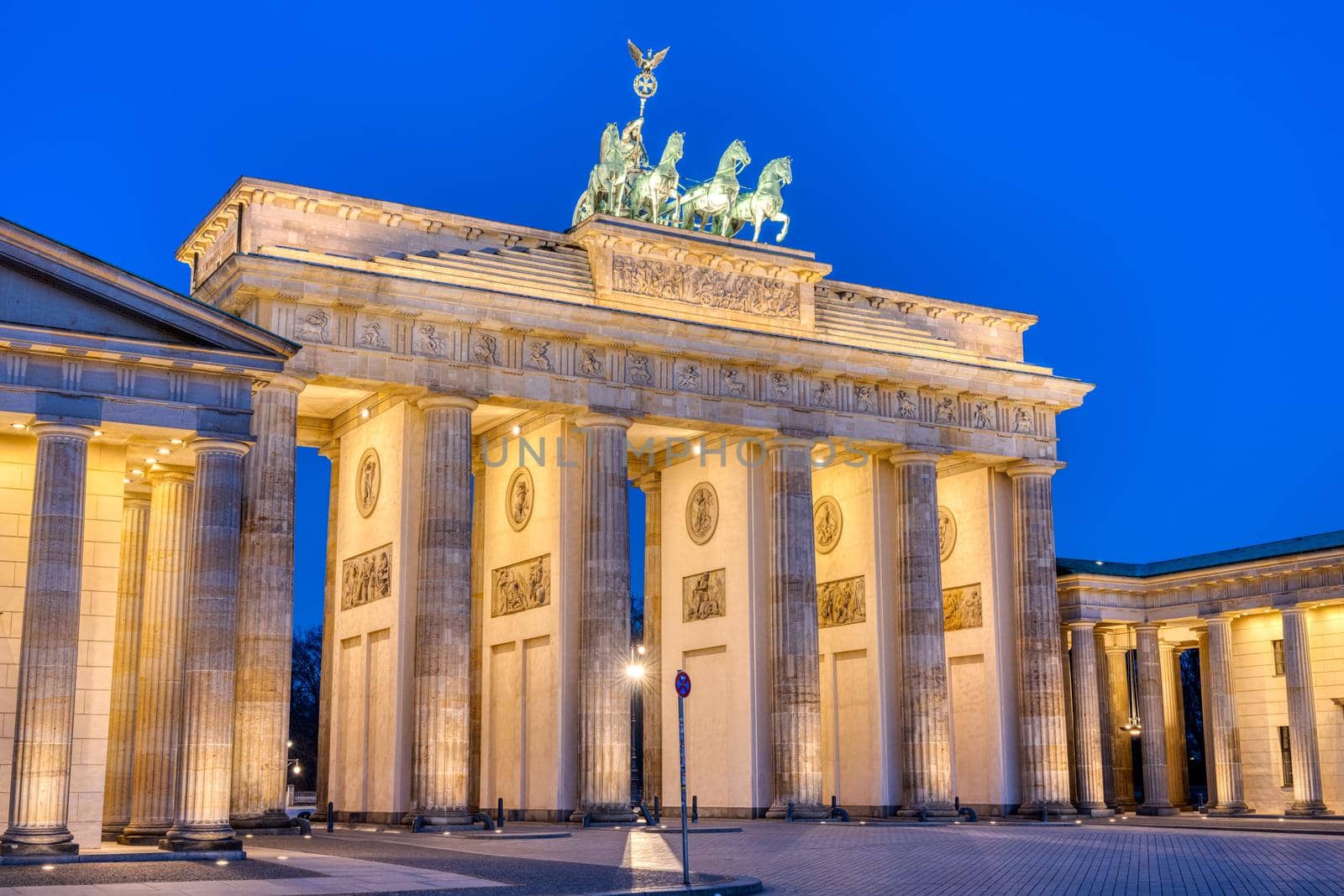 The famous illuminated Brandenburg Gate in Berlin by elxeneize