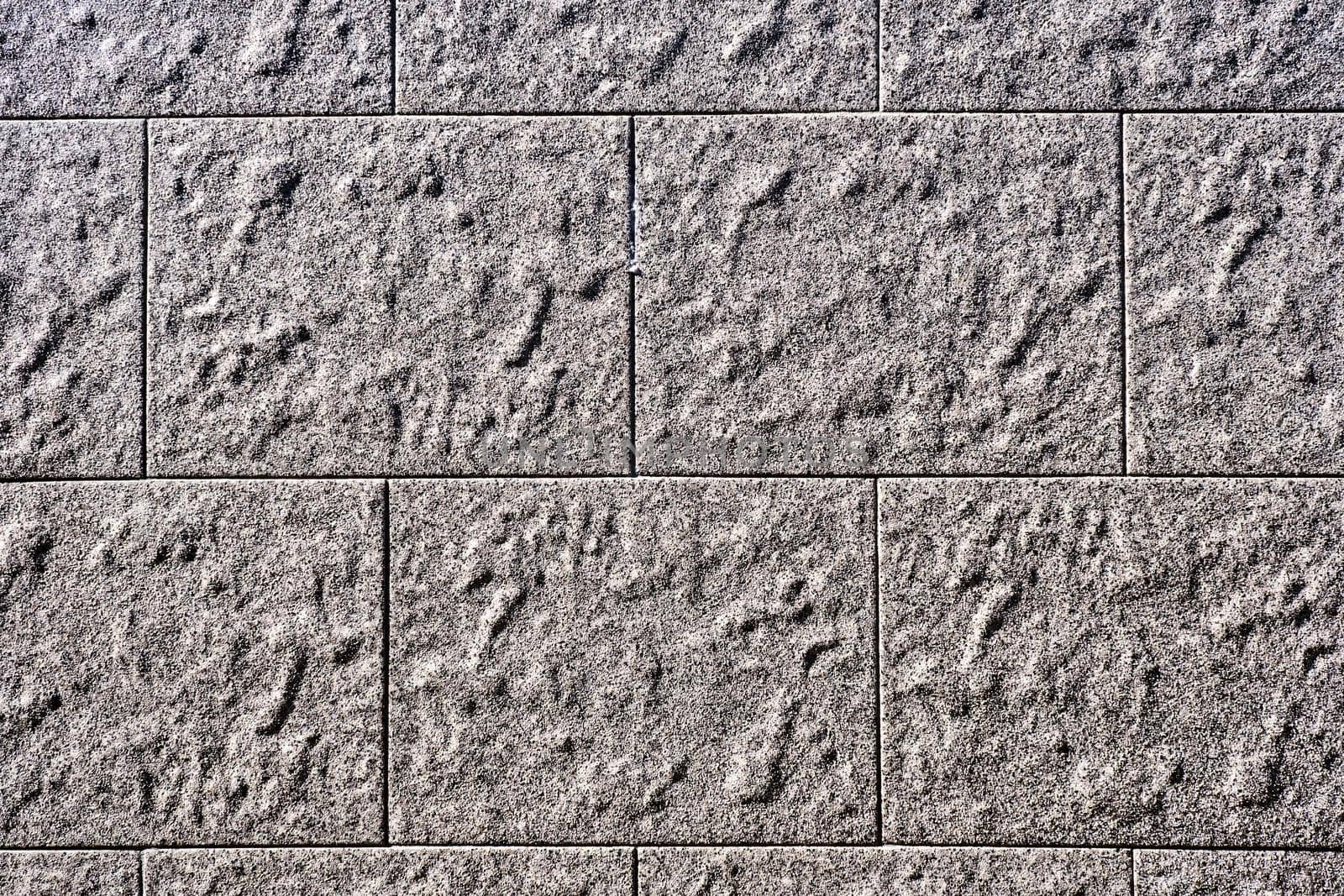 Wall with rectangular grey stone slabs by elxeneize