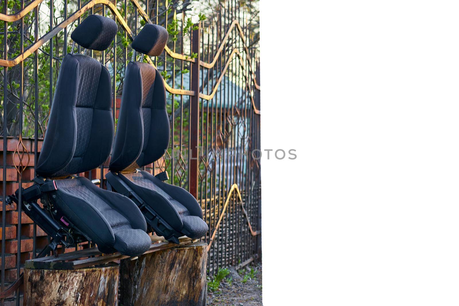 Two car seats drying in the sun after dry cleaning and place for text by jovani68