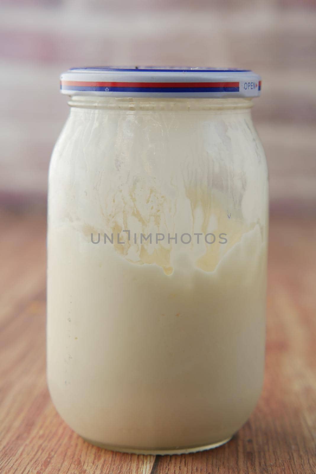close up of Mayonnaise in container on table