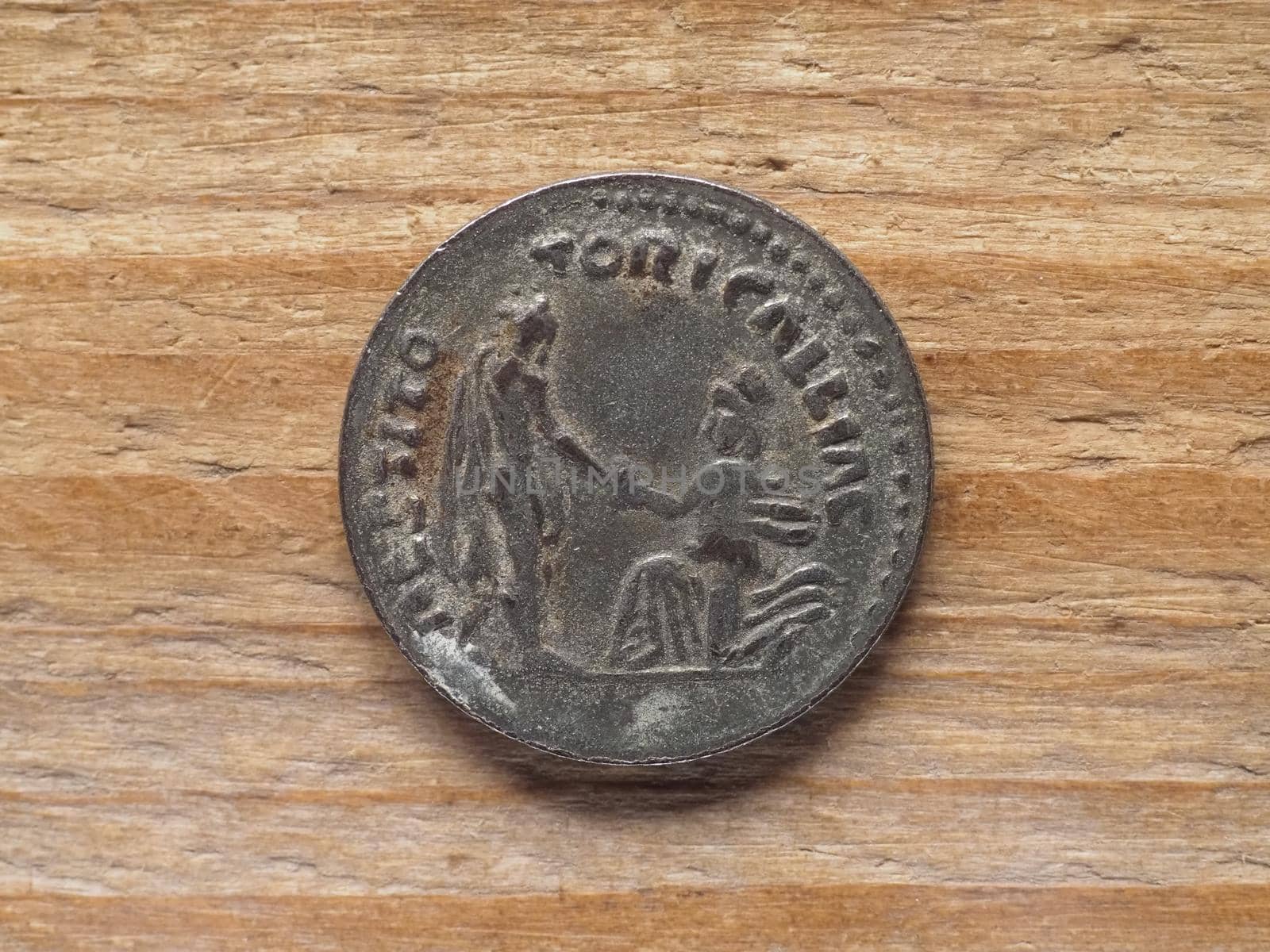Ancient Roman denarius coin reverse side showing restoration of Gaul by emperor Hadrian circa 130 bC