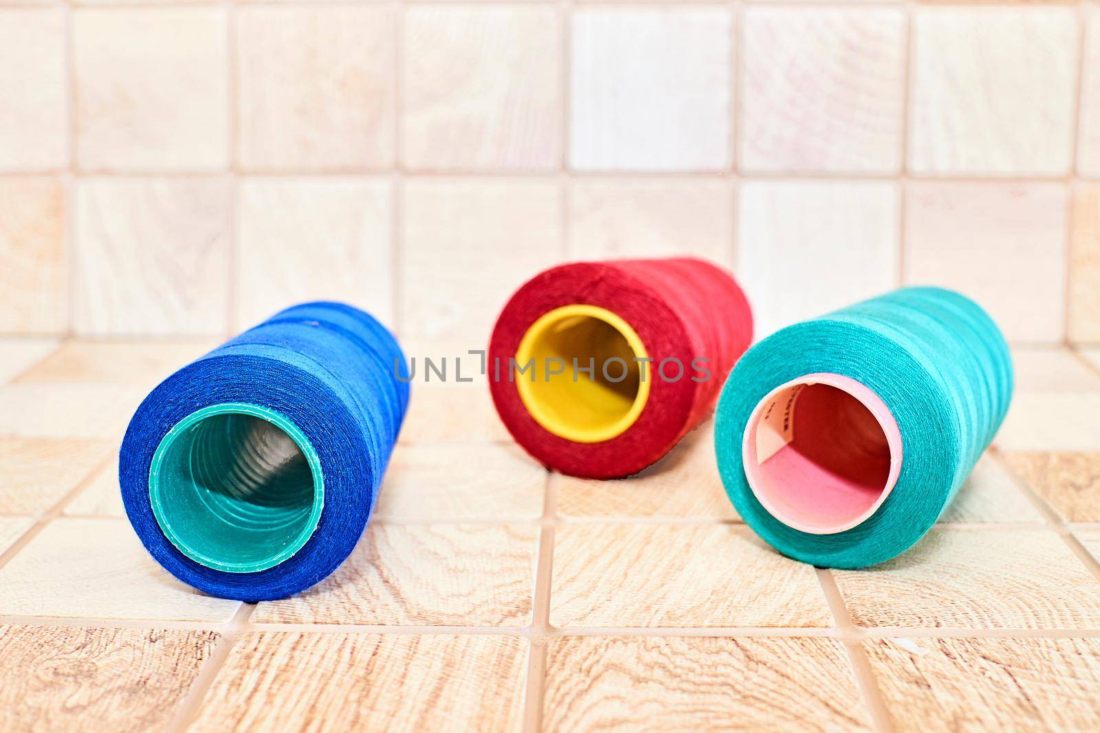 Three spools of thread. Navy, red and blue by jovani68