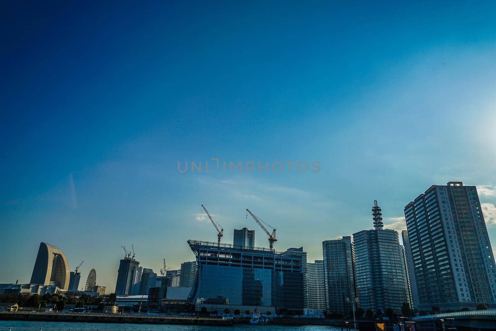 Construction crane and the city of Yokohama Minato Mirai. Shooting Location: Yokohama-city kanagawa prefecture