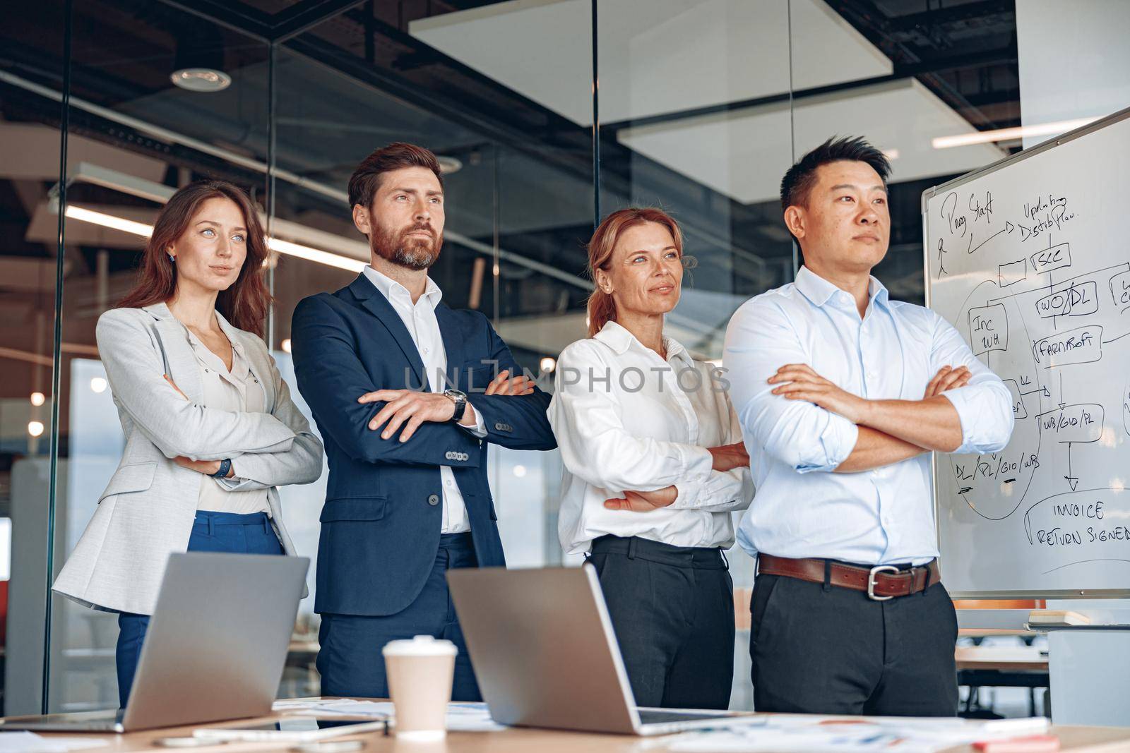 group portrait.project managers and business team standing near each other and looking in future.