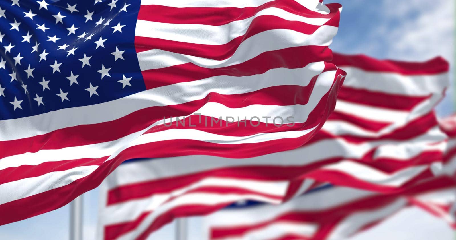 Three flags of the United States of America waving in the wind by rarrarorro