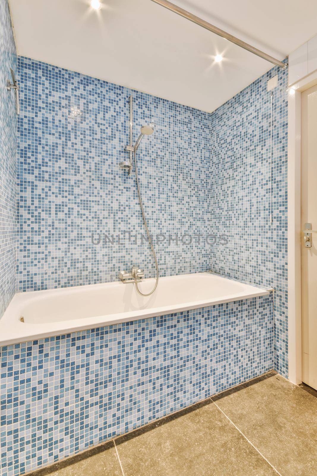 Small bedroom tiled with blue tiles by casamedia