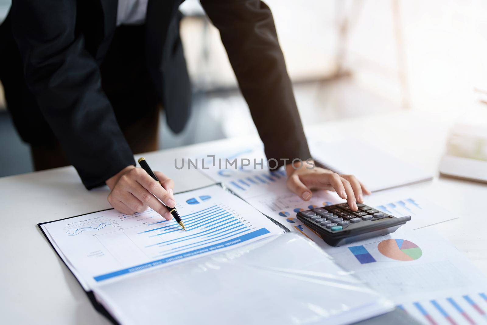 data analysis, plan, marketing, accounting, audit, asian business woman holding pen of planning marketing using statistical data sheet and calculator to present marketing plan project at meeting