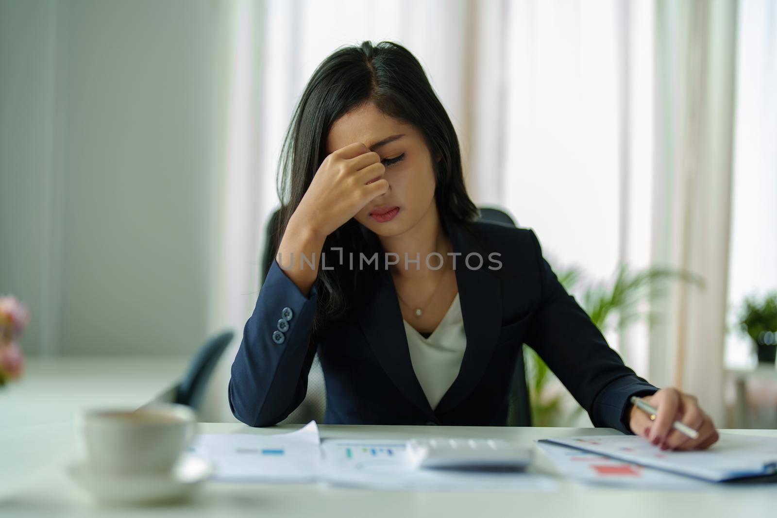 Concept Burnout Syndrome. Business Woman feels uncomfortable working. Which is caused by stress, accumulated from unsuccessful work And less resting body. Consult a specialist psychiatrist. by Manastrong